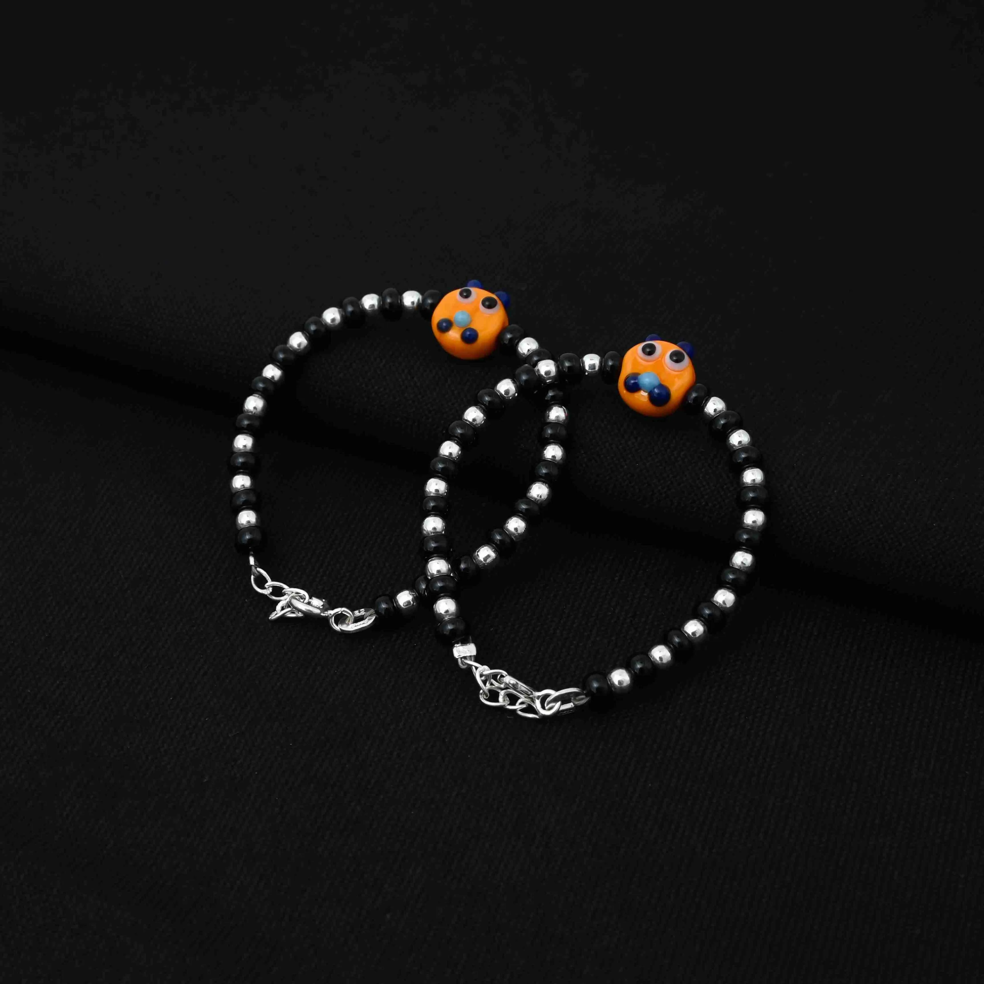 Silver Black and Silver Beads with Orange Teddy Bear Design Bracelet